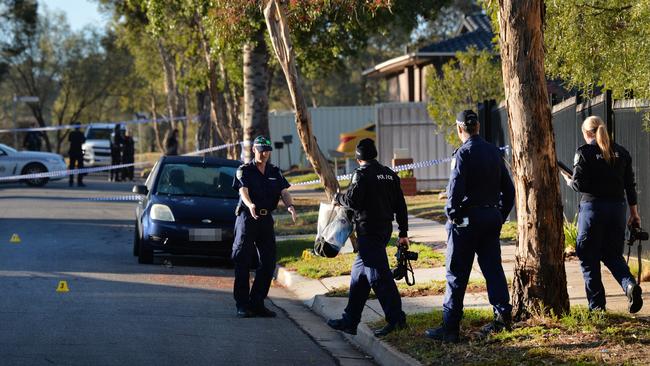 Police investigators gather evidence at the scene on Burri St, Ingle Farm. Picture: AAP/Mark Brake