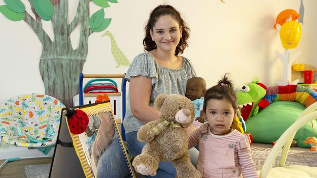 Peer support worker Molli Robinson and her daughter Armani Savea at the Young Mothers for Young Women centre in Caboolture. (AAP/Image Sarah Marshall)