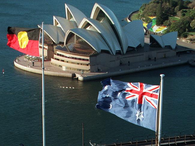 The Aboriginal and Australian flags flying over Sydney Harbour Bridge. Picture: Warren Clarke