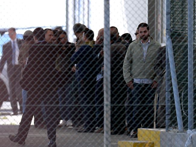 Passengers stand at Larnaca airport after disembarking the plane. Picture: AFP / George Michael