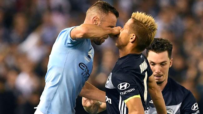 Keisuke Honda comes face to face with Florin Berenguer-Bohrer. Picture: AFP Images