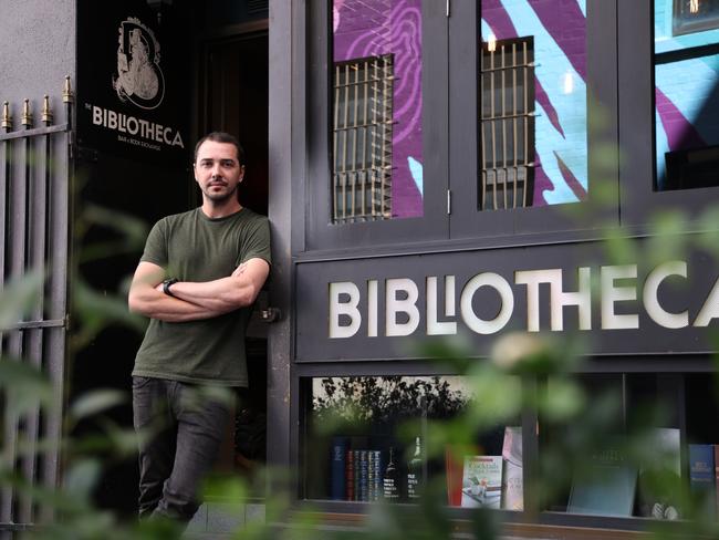 Roman Tazhdynov in his Bibliotheca bar in Adelaide. Picture: David Mariuz