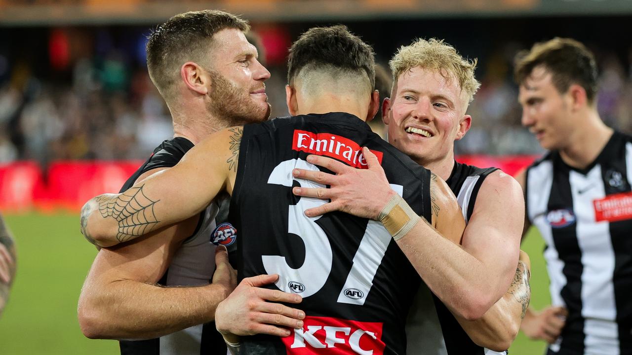 Adams, Oleg Markov and John Noble celebrate the win over Gold Coast. Picture: Russell Freeman/AFL Photos