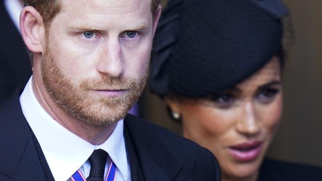 Britain's Prince Harry, Duke of Sussex and Meghan, Duchess of Sussex leave after a service for the reception of Queen Elizabeth II's coffin at Westminster Hall, in the Palace of Westminster in London on September 14, 2022, where the coffin will Lie in State. - Queen Elizabeth II will lie in state in Westminster Hall inside the Palace of Westminster, from Wednesday until a few hours before her funeral on Monday, with huge queues expected to file past her coffin to pay their respects. (Photo by Danny Lawson / POOL / AFP)