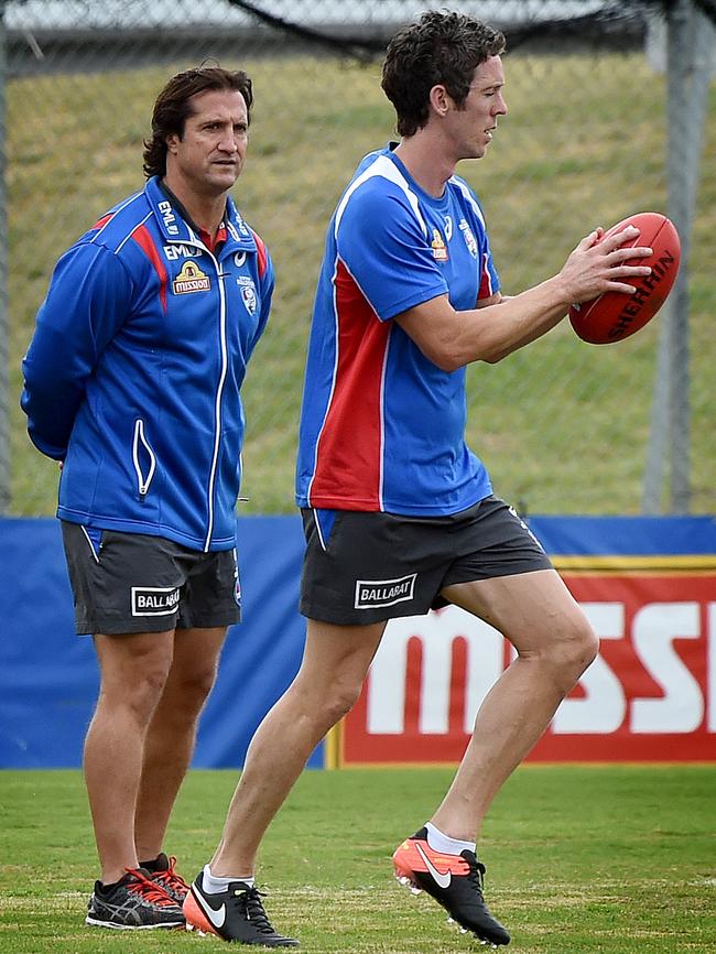 Luke Beverage watches Bob Murphy. Picture: Nicole Garmston