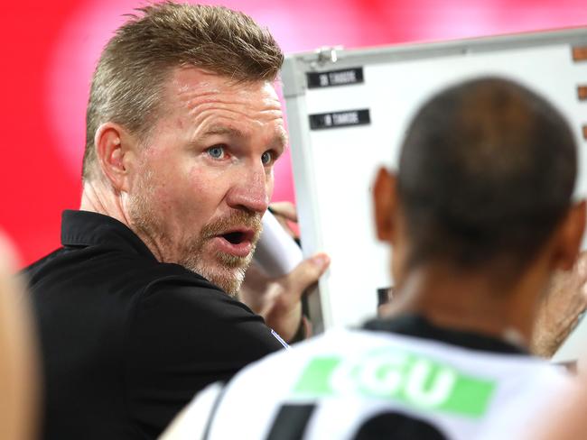 BRISBANE, AUSTRALIA - AUGUST 15: Magpies coach Nathan Buckley talks to his team during the round 12 AFL match between the Melbourne Demons and the Collingwood Magpies at The Gabba on August 15, 2020 in Brisbane, Australia. (Photo by Jono Searle/AFL Photos/via Getty Images)