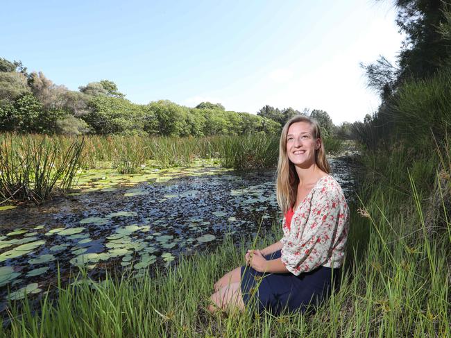 Rosalinde Brinkman is the Gold Coast Catchment Associations Executive officer. Rosalinde, 24 , works in the field of preservation and improvement of our natural areas through community engagement and upskilling our local community. Rosalinde looks at some of the coasts wetland areas. Picture Glenn Hampson