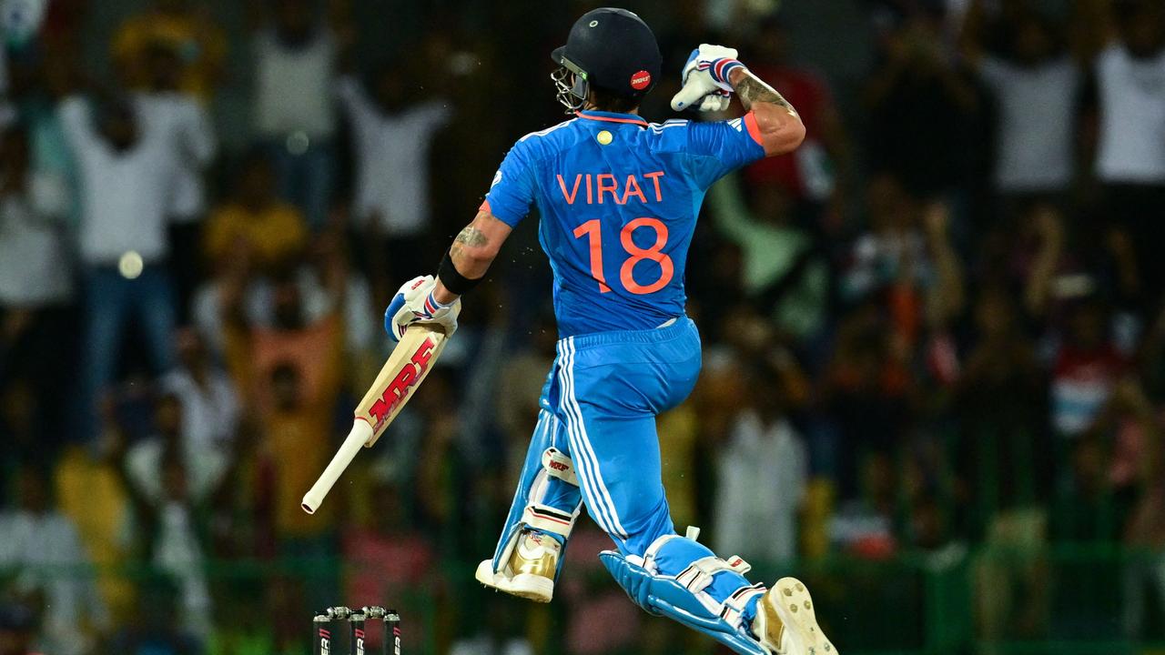India's Virat Kohli celebrates after scoring a century.