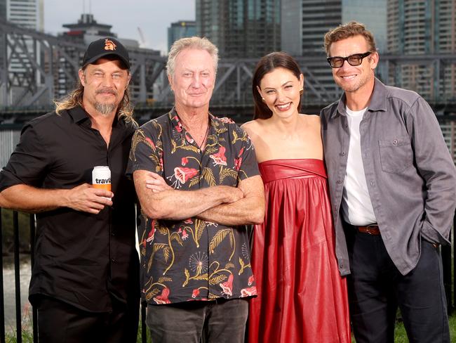 L to R, Travis Fimmel, Bryan Brown, Phoebe Tonkin, and Simon Baker, the cast of Boy Swallows Universe, near Wilson's lookout, with the Story Bridge behind, on Tuesday 9th January 2024 - Photo Steve Pohlner