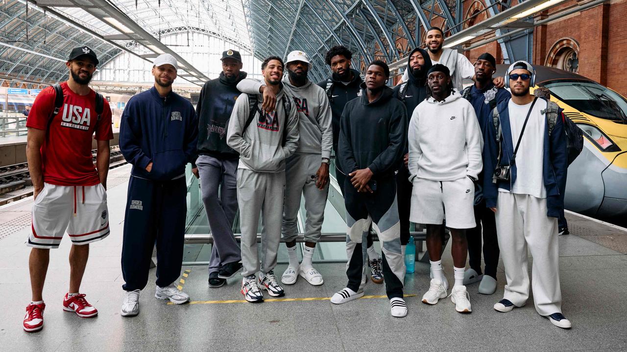 Team USA poses for a photo before departing London on the train. (Photo by Benjamin Cremel/AFP)