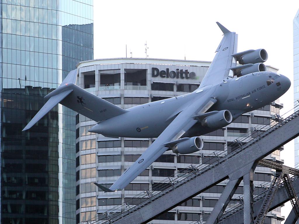 The Boeing C-17 Globemaster flies low. Picture: AAP/Richard Gosling