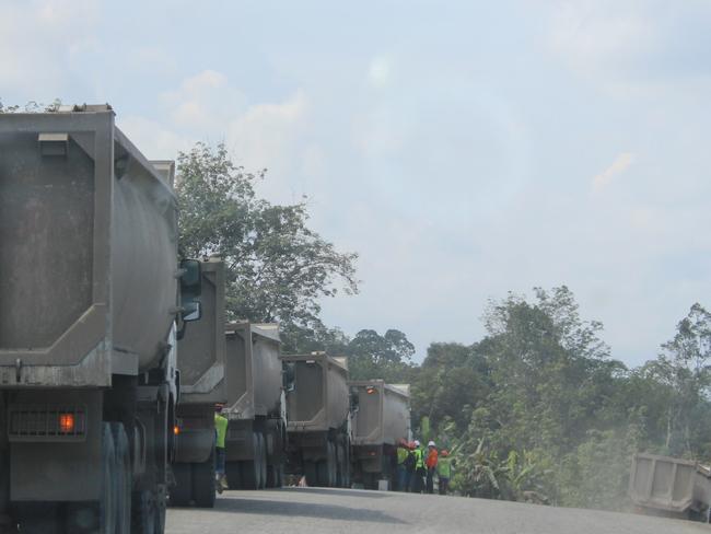 Coal trucks line up at the Marunda Graha Mineral mine near Maruwai. Picture: Jenny Denton