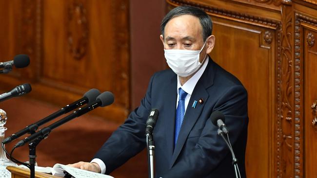 Prime Minister Yoshihide Suga has to balance the games and his political survival