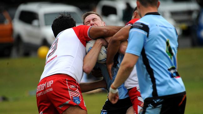 Woolgoolga fullback Dane O'Hehir tackled by the South Grafton defence. Picture: Leigh Jensen