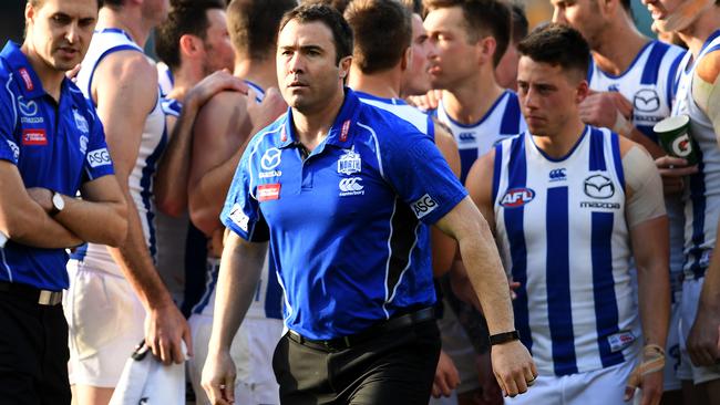 Brad Scott walks away after talking to his players during the game against Brisbane.