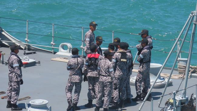 Malaysian crew members gather on deck. Picture: Harry Brill.