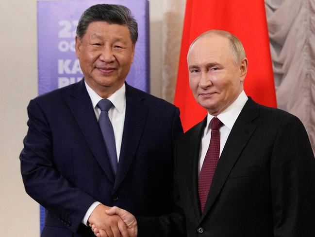 Russia's President Vladimir Putin meets with Chinese President Xi Jinping on the sidelines of the BRICS summit in Kazan on October 22, 2024. (Photo by Alexander Zemlianichenko / POOL / AFP)