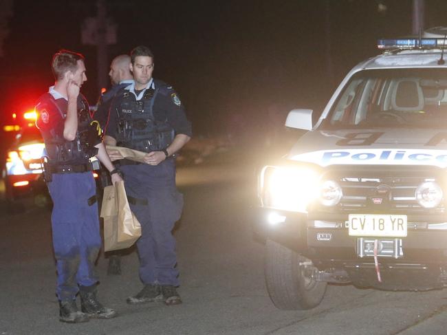 Evidence is collected by police at a fatal MVA   Picture : Steve Tyson  Time : 2320 Location : 5 Caladenia Close, Elenora Heights Description : 1 x 16 year old male deceased at the scene of an MVA after a car carrying 6 teenagers crashed into a fence