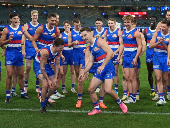 Liberatore attempts to chair Rhylee West off the ground after the win. Picture: Daniel Pockett/Getty Images