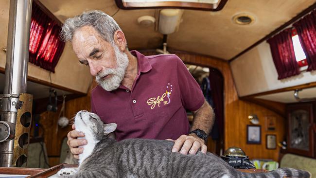 SYDNEY, AUSTRALIA, NOVEMBER 22, 2023. Sylph VI skipper and owner Robert â€˜Bobâ€™ Williams with his cat Oli who will sail with Bob in the Sydney to Hobart yacht race on board Sylph VI. Photographer: Adam Yip