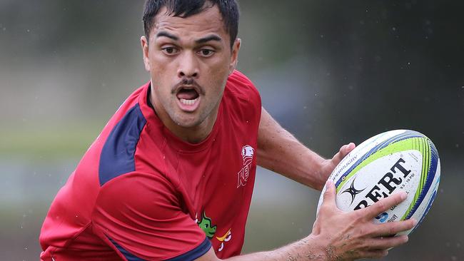 Karmichael Hunt runs with the ball at Reds training.