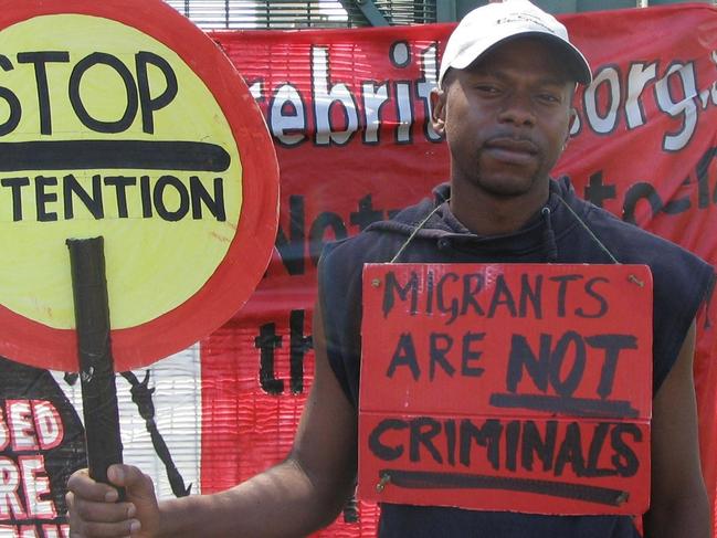 ONE TIME WEB USE FOR NEWS.COM.AU ONLY - FEES APPLY - ANY OTHER USE MUST DOWNLOAD ON OWN ACCOUNT - G8ETJ1 Asylum seeker Anicet Mayela, 32, a former economics student from the Republic of Congo, at Campsfield House detention centre front gates, Kidlington, near Oxford. Protesters gathered in support of hunger-striking failed asylum seekers being held in custody prior to deportation from Britain. Around 20 people assembled at the front gates of Campsfield House for the peaceful demonstration. Protest followed the death by hanging at the centre of a Turkish man. Picture: Alamy