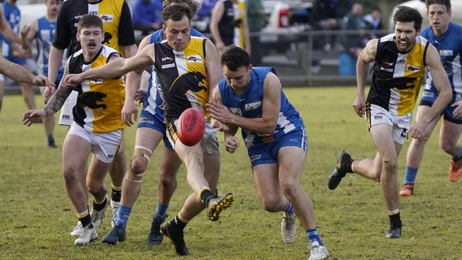 EFL: Chirnside Park’s Joshua Clavant gets his kick away under pressure. Picture: Valeriu Campan