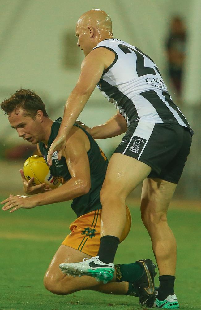 Gary Ablett Jr tackles Harrison Ling as Palmerston take on St Mary’s. Picture: Glenn Campbell