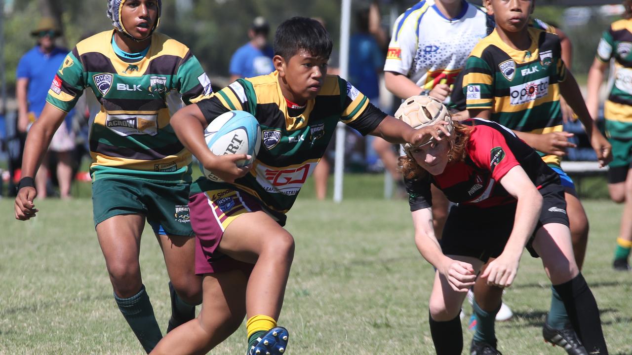 King of the Country U/13 Rugby Union tournament at Overall park Southport. Surfers Paradise(Yellow Green ) V Far North Coast (red black). Picture Glenn Hampson