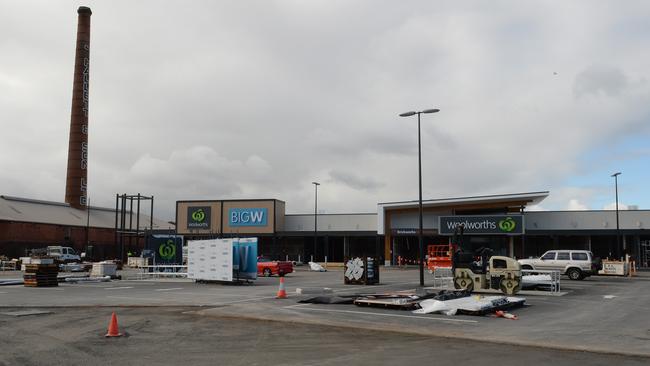 The iconic stack is visible during construction of the new shopping precinct. Picture: Campbell Brodie