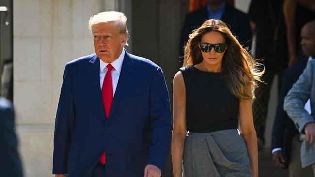 Donald Trump and Melania Trump leave a polling station after voting in the US midterm elections in Palm Beach, Florida. Picture: AFP.