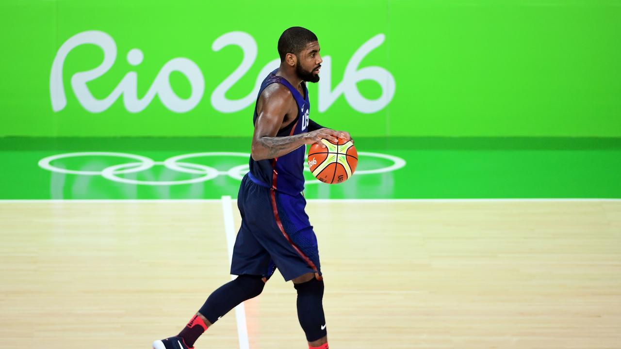USA's guard Kyrie Irving dribbles during a Men's semifinal basketball match between Spain and USA at the Carioca Arena 1 in Rio de Janeiro on August 19, 2016 during the Rio 2016 Olympic Games. / AFP PHOTO / EMMANUEL DUNAND