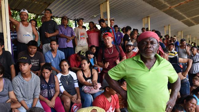 Members of the caravan rest at Matias Romero. Picture: AFP