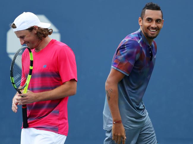 Matt Reid and Nick Kyrgios share a laugh during their remarkable US Open doubles win over Joao Sousa and Jan-Lennard Struff in 2017. Picture: Richard Heathcote/Getty Images/AFP