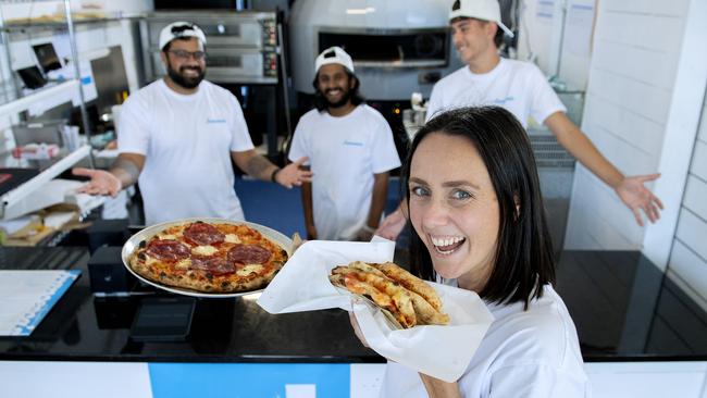 Roma Driscoll with a pizza a portafoglio and The Goomah pizza at Francesca's at Glenelg with co-owners Aman Takher, Nilavan Baskaran and Aiden O'Sullivan. Picture: Mark Brake
