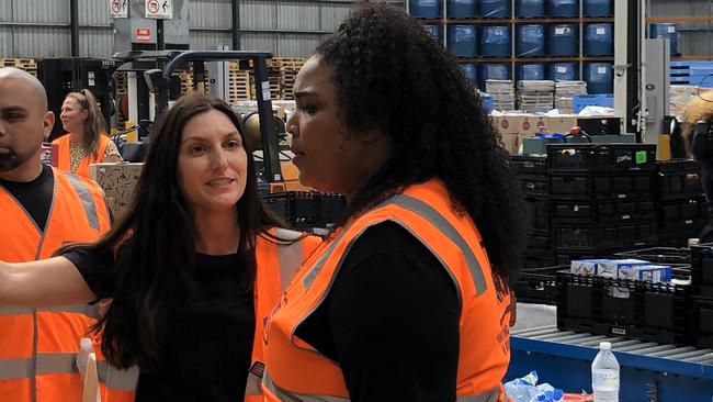 Lizzo helps foodbank victoria to sort and pack hampers to help. Picture: Supplied