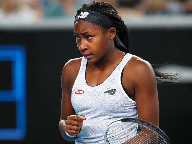 MELBOURNE, AUSTRALIA - JANUARY 20: Coco Gauff of the United States of America celebrates after winning a point during her Women's Singles first round match against Venus Williams of the United States of America on day one of the 2020 Australian Open at Melbourne Park on January 20, 2020 in Melbourne, Australia. (Photo by Cameron Spencer/Getty Images)