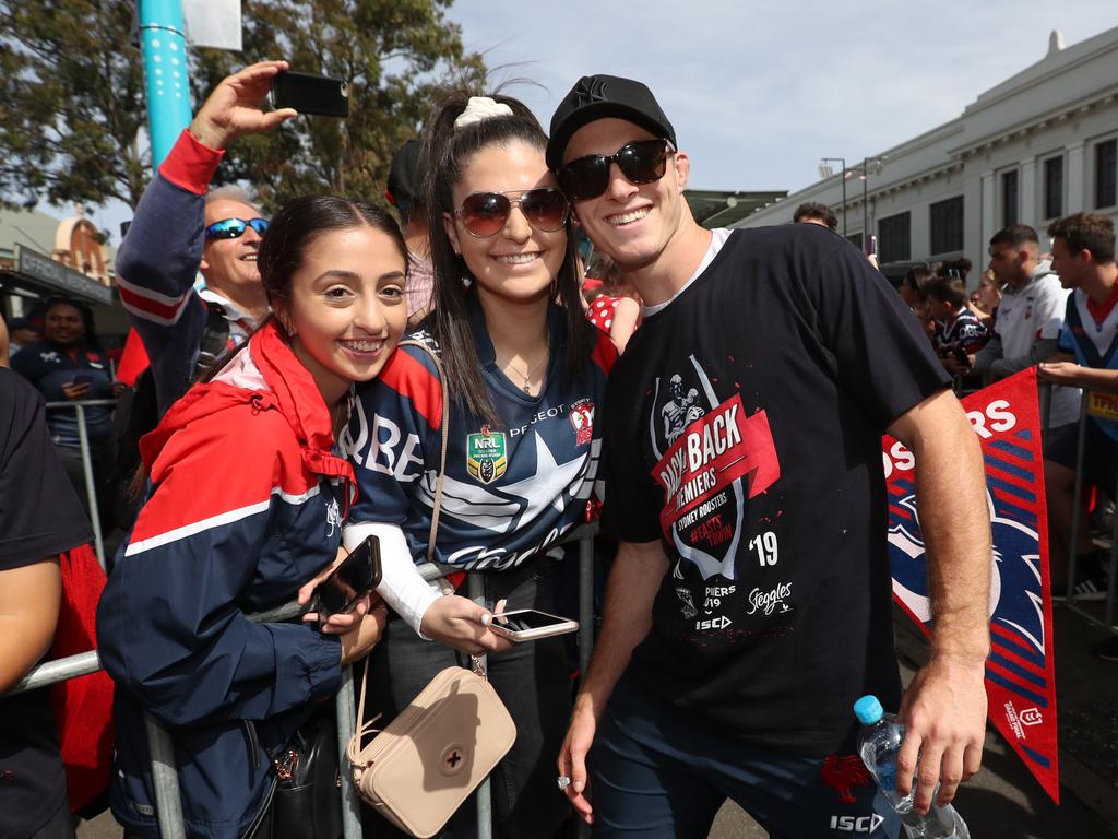 Caroline Manookian , Rebecca Warian and Sam Verrills pictured at the Sydney Roosters fan morning at Moore Park after the Roosters win in the 2019 NRL Grand Final. Picture: Richard Dobson