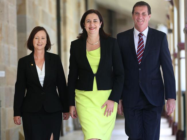 The laws are a reason to smile for their chief proponents Premier Annastacia Palaszczuk (centre), Attorney-General Yvette D'Ath and surgeon-turned-minister Anthony Lynham. Pic Annette Dew