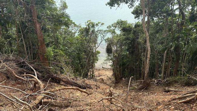 Landslides run for hundreds of metres down cliff faces and into the ocean on the Bloomfield Track between Wujal Wujal and Cape Tribulation.