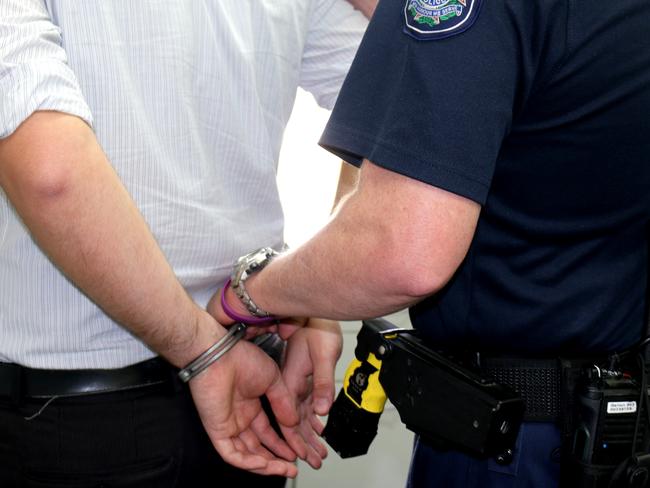 A man being handcuffed by police. Generic queensland police. Photo Amy Lyne / Gatton Star