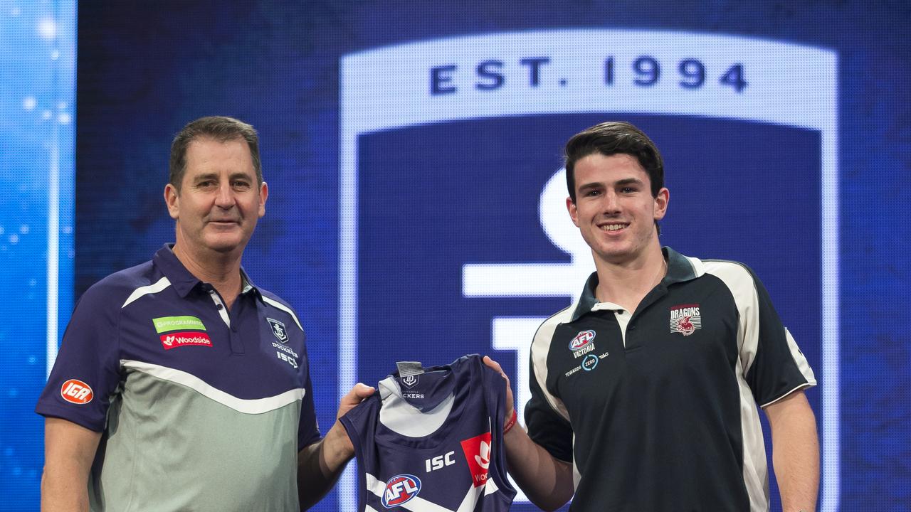 Andrew Brayshaw from the Sandringham Dragons (right) is presented with his guernsey by Fremantle Dockers coach Ross Lyon after being selected as the No. 2 draft pick during the first round of the 2017 AFL Draft at the Sydney Showground in Sydney, Friday, November 24, 2017. (AAP Image/Brendan Esposito) NO ARCHIVING, EDITORIAL USE ONLY