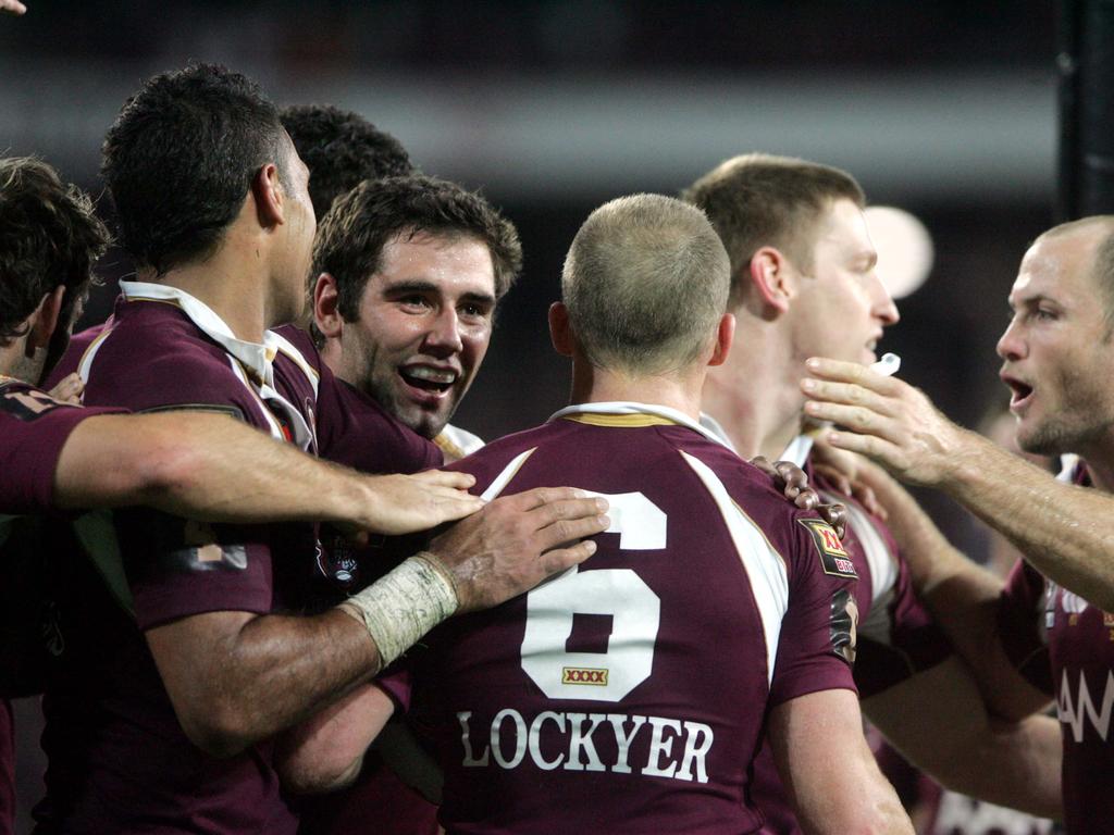 Qld's Darren Lockyer is congratulated by Maroon’s after scoring a try.