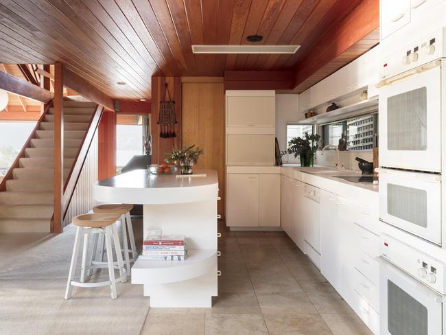 Architect Ken Woolley and developer Brian Petit designed this three-bedroom home in 1985. Marcus Lloyd-Jonmes of Modern House says it has well-preserved examples of Formica kitchen benches and timber panelling. Picture: Tom Ferguson