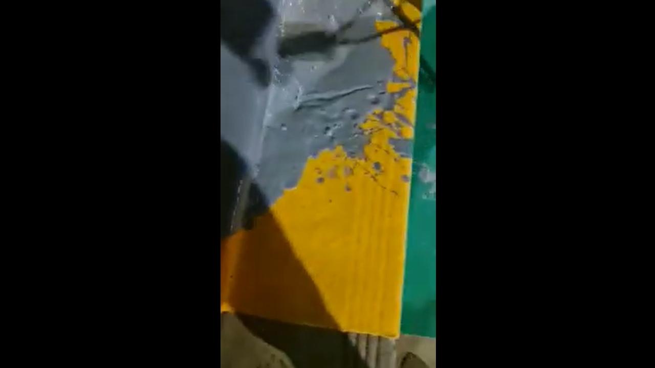 A group of men, believed to be Lebanese Maronite Christians, defacing the rainbow steps of the Pitt Street Uniting Church.