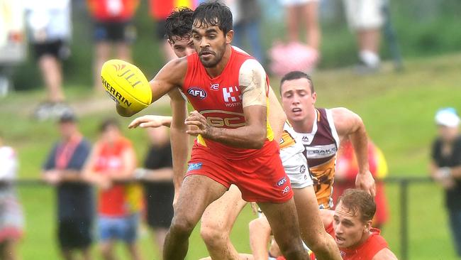 Jack Martin clears a kick for the Suns against Brisbane. Picture: Getty Images