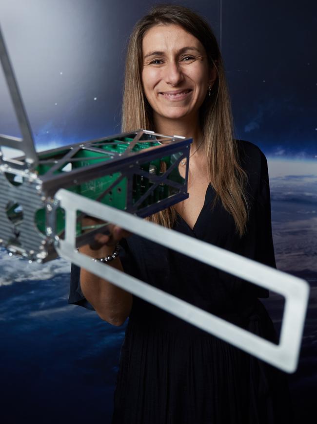 Flavia Tata Nardini from Fleet Space Technologies, with one of their nanosatellites. Picture: AAP / Matt Loxton