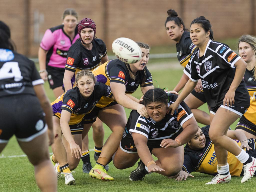 Elaina Saluni off-loads for Oakey under pressure from Gatton. Picture: Kevin Farmer.