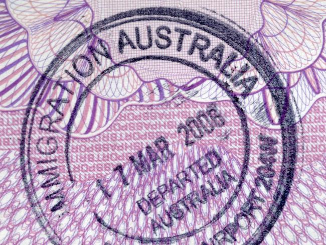 Departure stamp on the inside page of a passport.