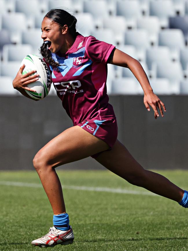 The Hills Sports High player makes a break before scoring a try against Erindale Sports Academy for the NRL Schoolgirls Cup at Campbelltown Stadium. Picture: Adam Yip